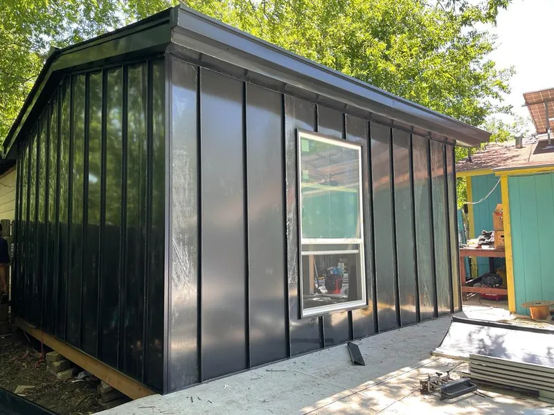 Black standing seam metal wall panels for Roof Inspection in Malverne